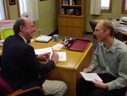 Nels Grevstad (Ph.D. 2003) speaks with Lafayette School Corporation superintendent Ed Eiler.